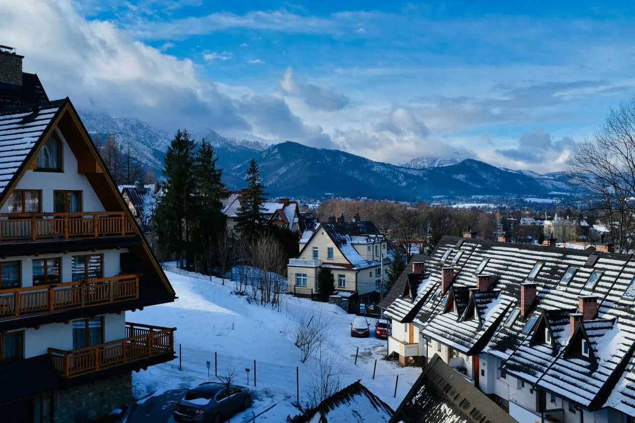 Kraków to Zakopane transfer route with Tatra Mountains and winter village scenery