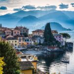 Lake Como lakeside village with mountains and colourful houses
