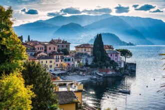Lake Como lakeside village with mountains and colourful houses