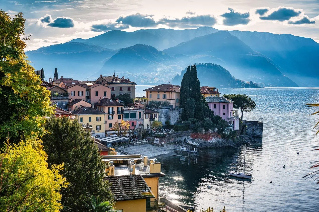 Lake Como lakeside village with mountains and colourful houses