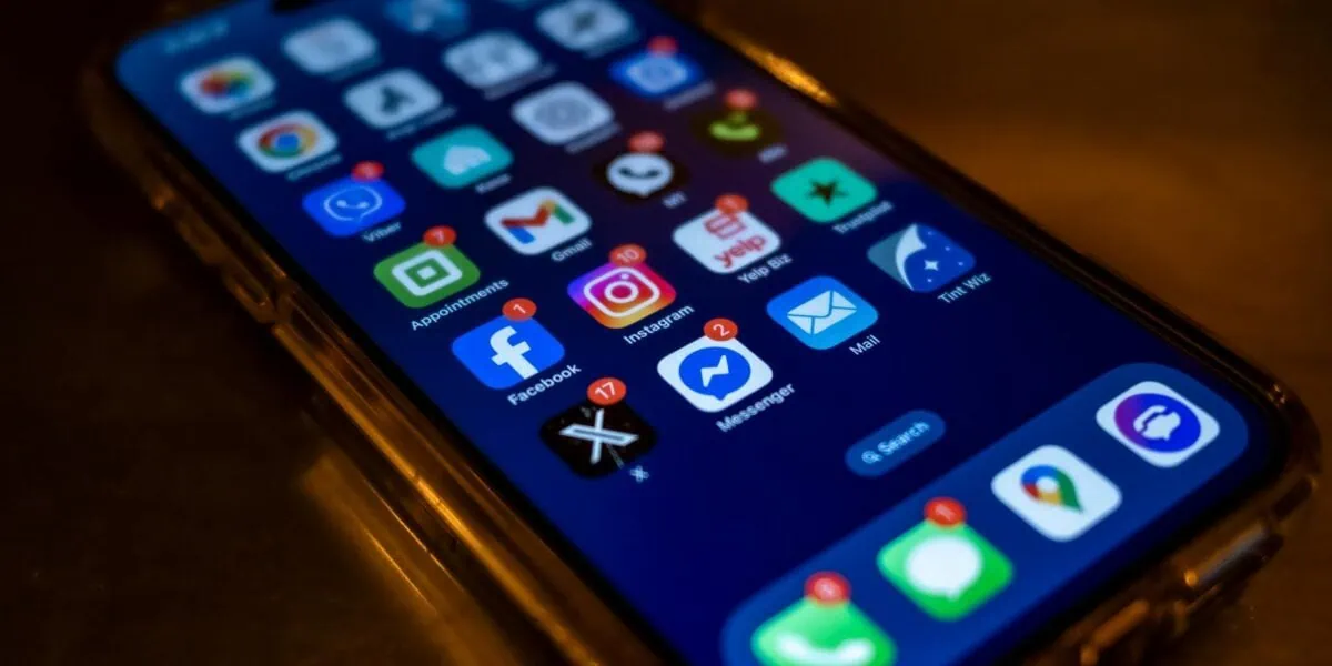 Smartphone displaying travel apps and mobile data notifications for international eSIM use