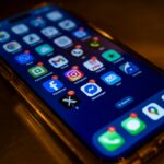 Smartphone displaying travel apps and mobile data notifications for international eSIM use