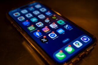 Smartphone displaying travel apps and mobile data notifications for international eSIM use