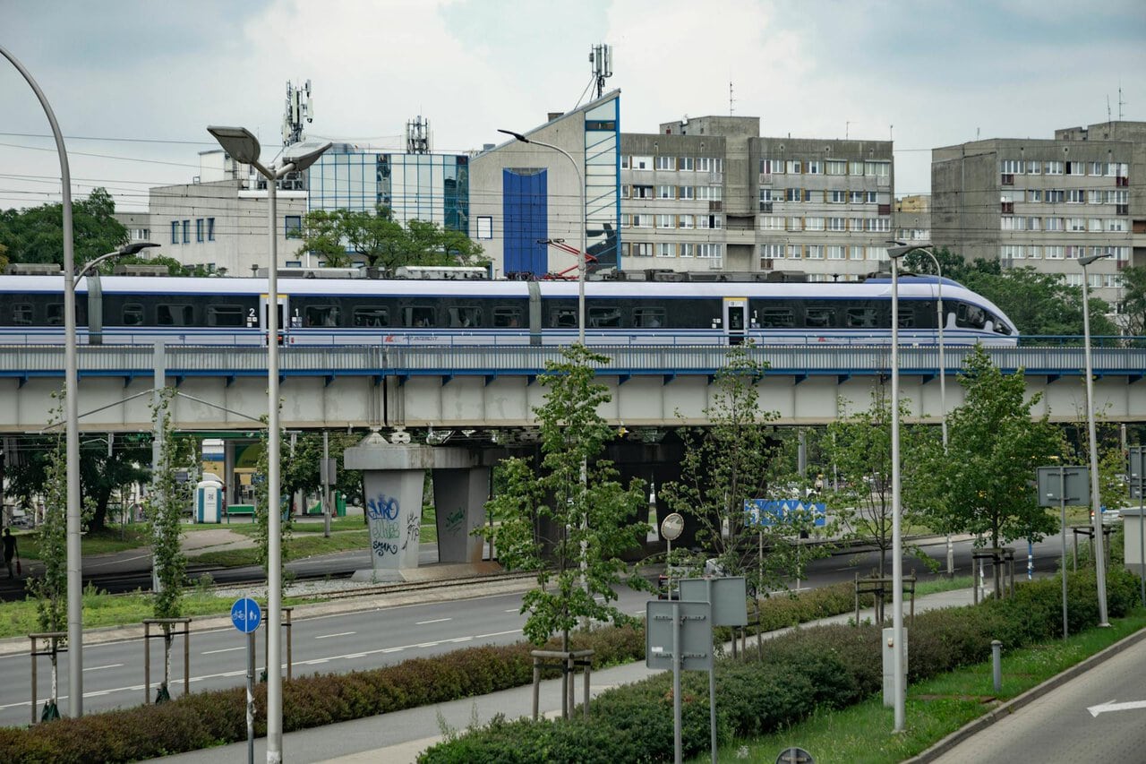PKP Intercity train travelling through Kraków on a modern railway viaduct in Poland