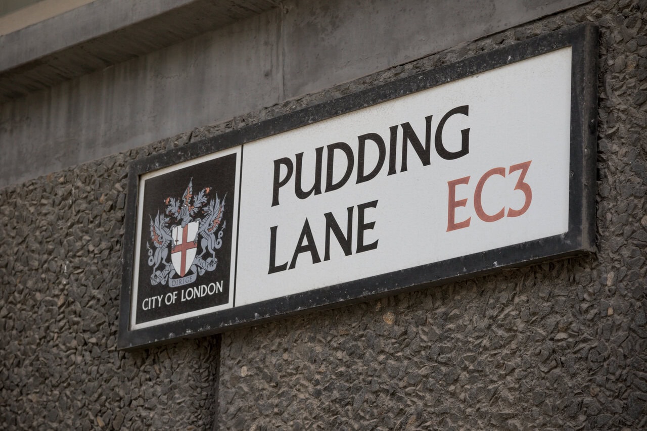 Pudding Lane street sign in the City of London marking the location where the Great Fire of London began in 1666.