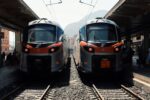 Modern Trenitalia regional trains standing at a railway station in Sicily, used for rail travel between cities such as Palermo, Catania, and Messina