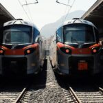 Modern Trenitalia regional trains standing at a railway station in Sicily, used for rail travel between cities such as Palermo, Catania, and Messina