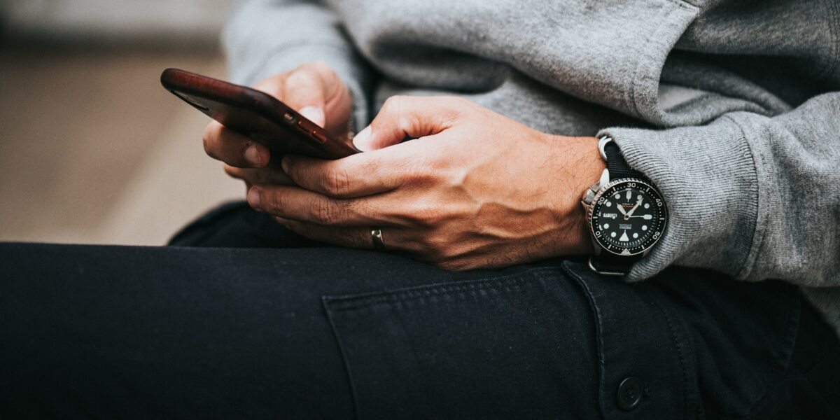 Traveller using a smartphone while comparing travel eSIM plans and mobile data options