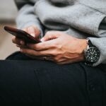 Traveller using a smartphone while comparing travel eSIM plans and mobile data options
