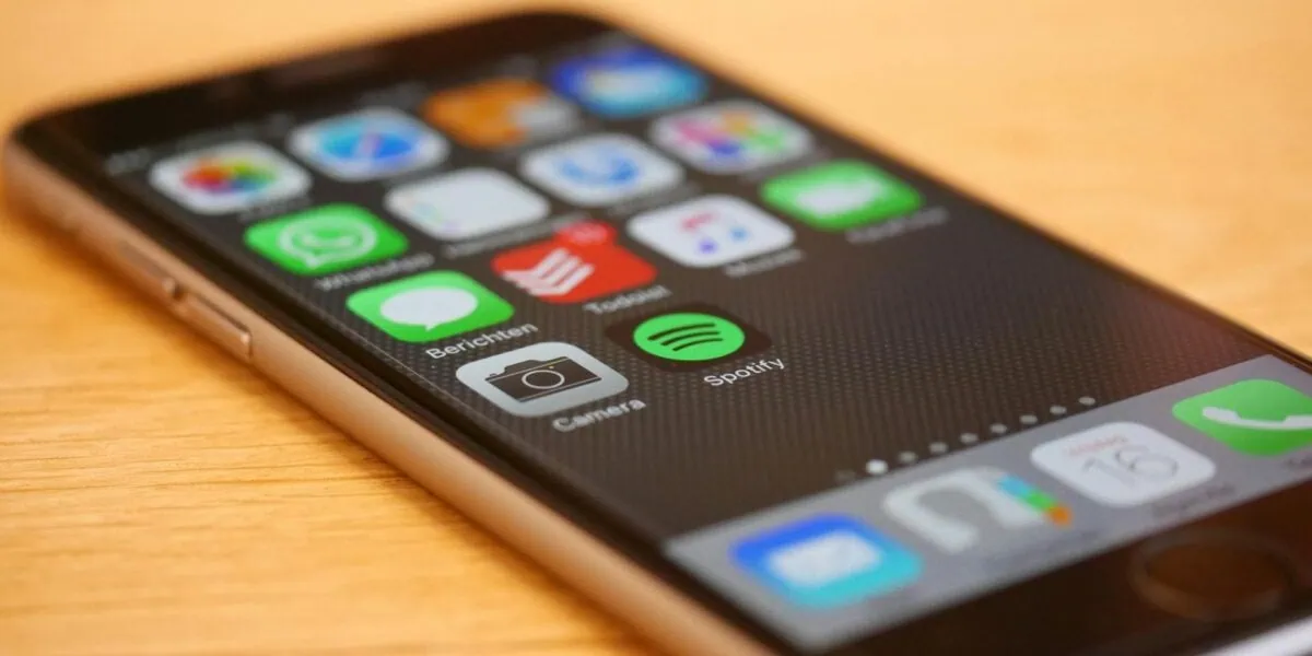 Smartphone showing travel apps and international mobile connectivity through eSIM technology