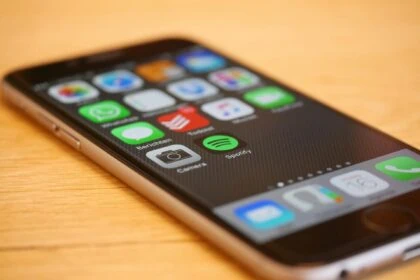 Smartphone showing travel apps and international mobile connectivity through eSIM technology