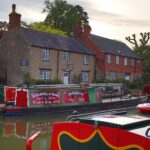 Traditional narrowboats moored on the Grand Union Canal at Stoke Bruerne