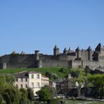 View of the medieval fortified walls of Carcassonne reached by train from Toulouse in southern France.