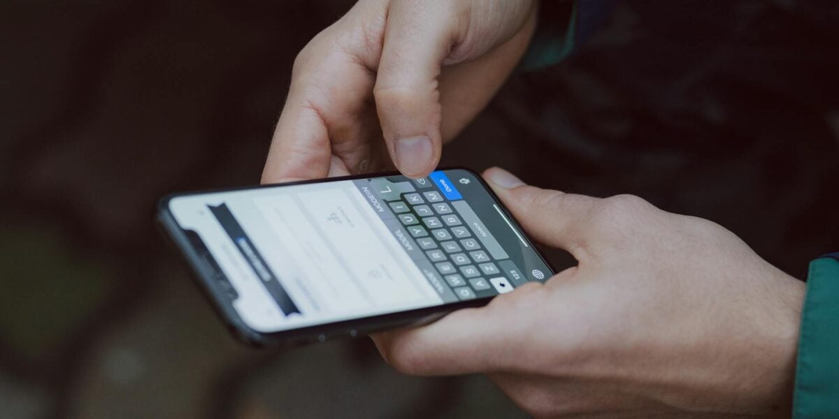 Traveller using smartphone abroad with travel eSIM connectivity and mobile data apps