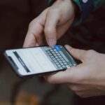 Traveller using smartphone abroad with travel eSIM connectivity and mobile data apps