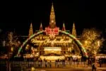 Vienna Christmas Market illuminated at night in front of Vienna City Hall during the festive season