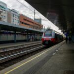 ÖBB airport train arriving at a Vienna railway station during a transfer into the city centre