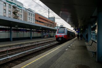 ÖBB airport train arriving at a Vienna railway station during a transfer into the city centre