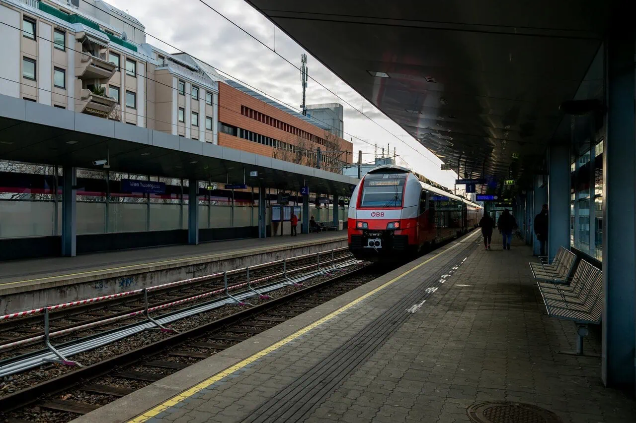 ÖBB airport train arriving at a Vienna railway station during a transfer into the city centre