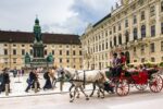 Horse-drawn carriage outside the Hofburg Palace in UNESCO-listed Vienna city centre