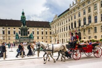 Horse-drawn carriage outside the Hofburg Palace in UNESCO-listed Vienna city centre
