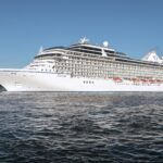 Ocean cruise ship sailing from Amsterdam Cruise Port near Passenger Terminal Amsterdam
