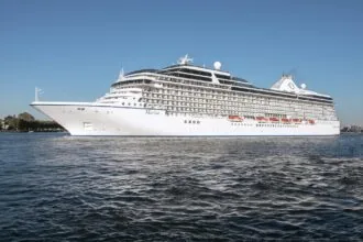 Ocean cruise ship sailing from Amsterdam Cruise Port near Passenger Terminal Amsterdam