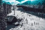 Skiers and chairlift in the French Alps near Chambéry