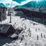 Skiers and chairlift in the French Alps near Chambéry