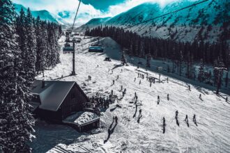 Skiers and chairlift in the French Alps near Chambéry