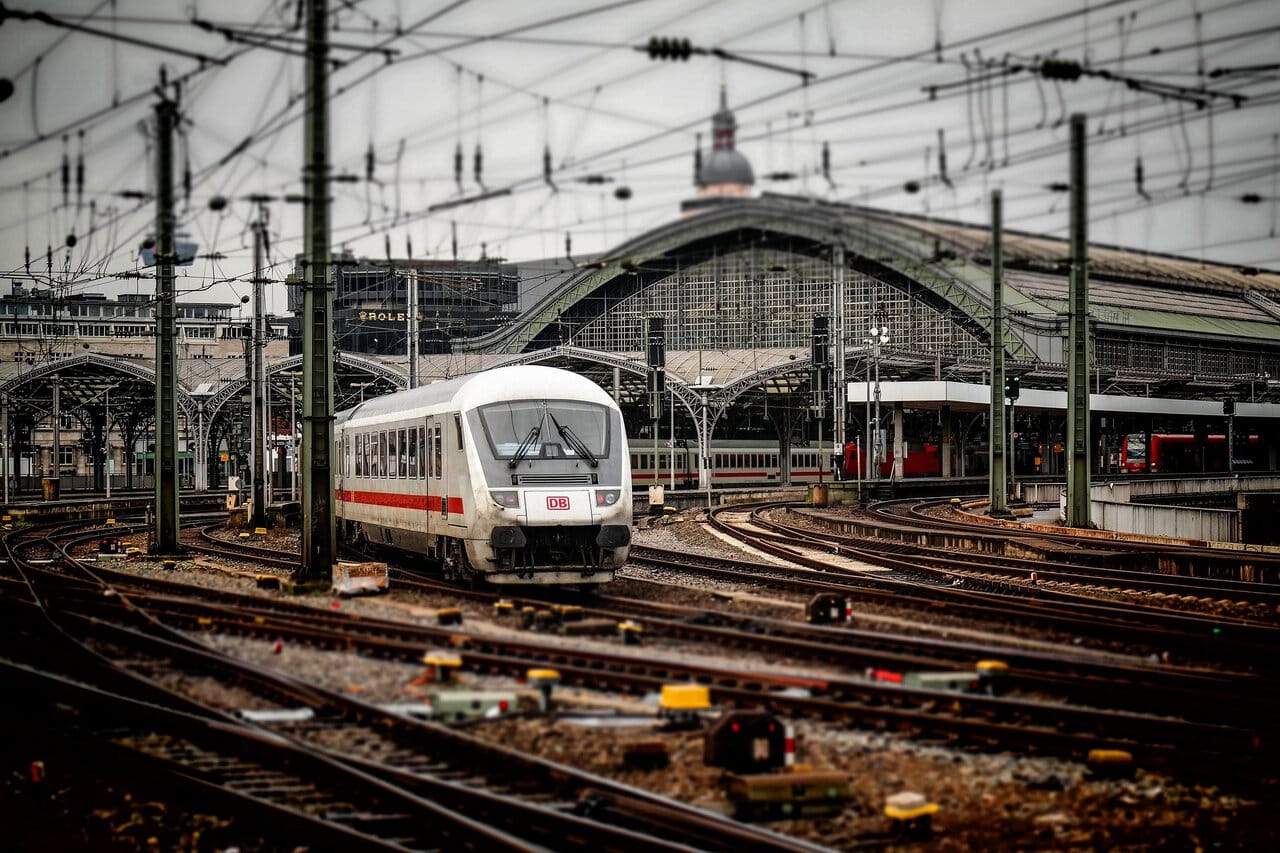 Deutsche Bahn train arriving at Cologne Central Station, the main rail hub connecting Cologne Bonn Airport with the city centre.