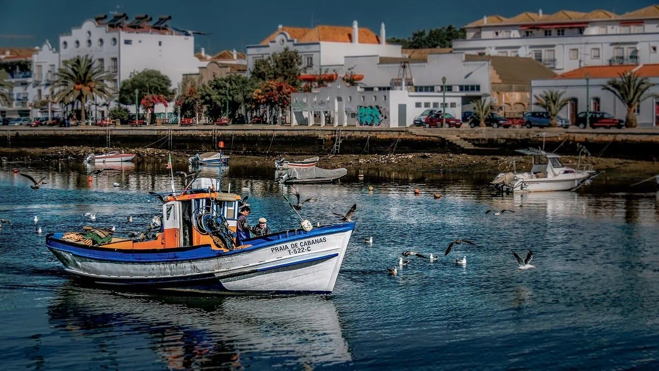 Traditional fishing boat in Tavira harbour, Algarve, Portugal.
