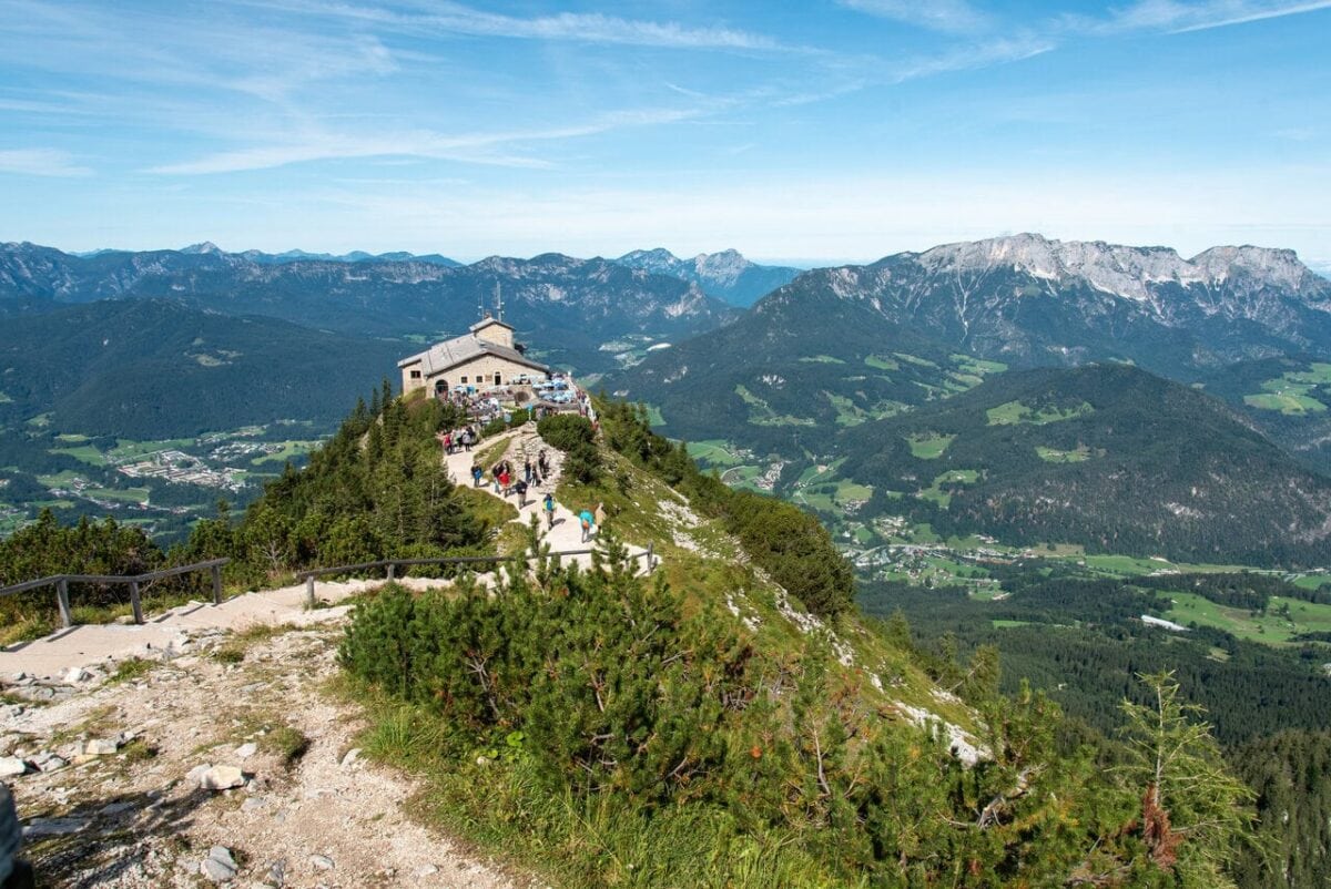 Visitors enjoying panoramic views from Eagle's Nest overlooking the Bavarian Alps near Berchtesgaden, Germany.