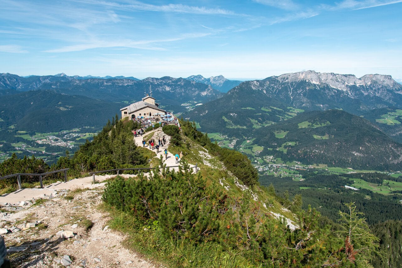 Visitors enjoying panoramic views from Eagle's Nest overlooking the Bavarian Alps near Berchtesgaden, Germany.