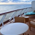 Private balcony cabin overlooking the ocean on a modern cruise ship