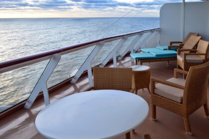 Private balcony cabin overlooking the ocean on a modern cruise ship