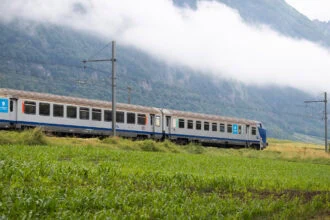 Regional train travelling through the French Alps