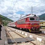 Passenger train at a railway station in Bulgaria near international rail routes.