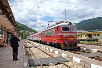 Passenger train at a railway station in Bulgaria near international rail routes.