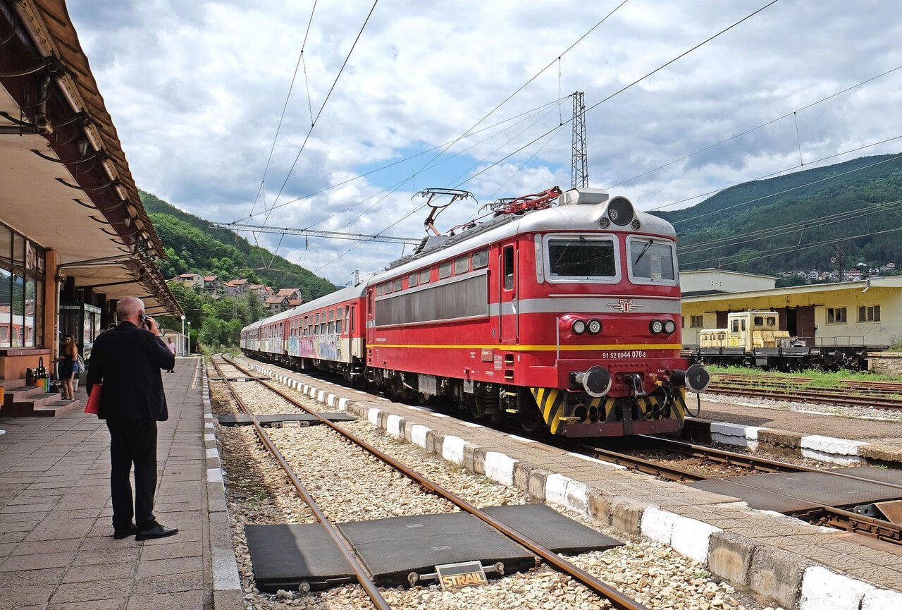 Passenger train at a railway station in Bulgaria near international rail routes.