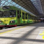 Green DART commuter train at Dublin Connolly Station in Ireland, useful for guides explaining Irish rail passes and train travel.