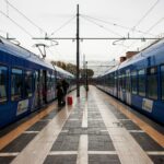 Modern Trenitalia regional trains at an Italian railway station