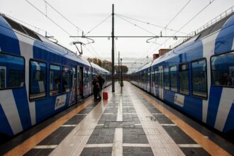 Modern Trenitalia regional trains at an Italian railway station