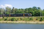Leo Express train travelling through the Czech countryside on an international route between Prague, Kraków, Košice and Frankfurt Airport.