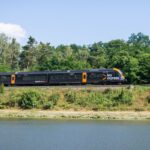 Leo Express train travelling through the Czech countryside on an international route between Prague, Kraków, Košice and Frankfurt Airport.