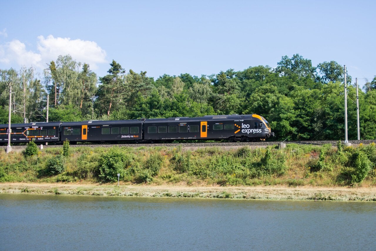 Leo Express train travelling through the Czech countryside on an international route between Prague, Kraków, Košice and Frankfurt Airport.