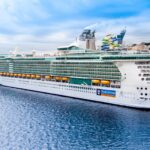 Royal Caribbean cruise ship docked at Lisbon Cruise Terminal on the Tagus River.