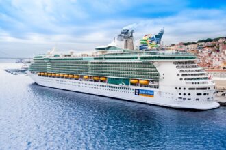 Royal Caribbean cruise ship docked at Lisbon Cruise Terminal on the Tagus River.