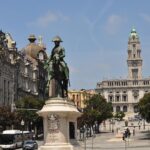 Statue of King Pedro IV in Avenida dos Aliados with Porto City Hall in the background.