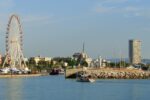 Rimini harbour with the famous Ferris wheel, marina, lighthouse and Adriatic waterfront on Italy's Adriatic coast.